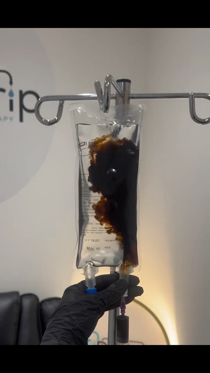 An IV infusion bag branded with the Drip IV logo